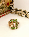 Sweet 14K Gold and Peridot Buckle Ring